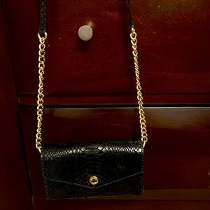 Black wallet on a chain purse